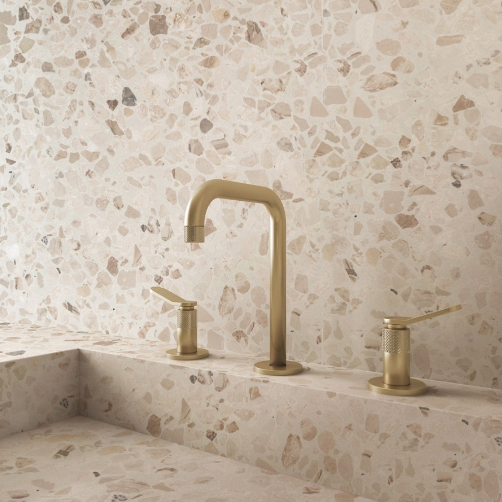 Lifestyle image of the Crosswater Calix Brushed Brass 3 Tap Hole Deck Mounted Basin Mixer mounted on a basin deck